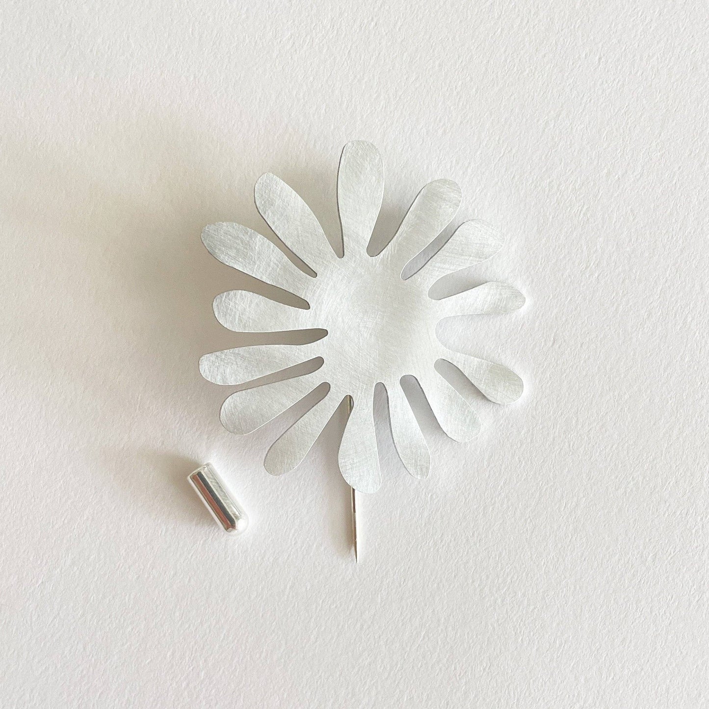 Tom Pigeon - Silver Aluminium Aster Pin